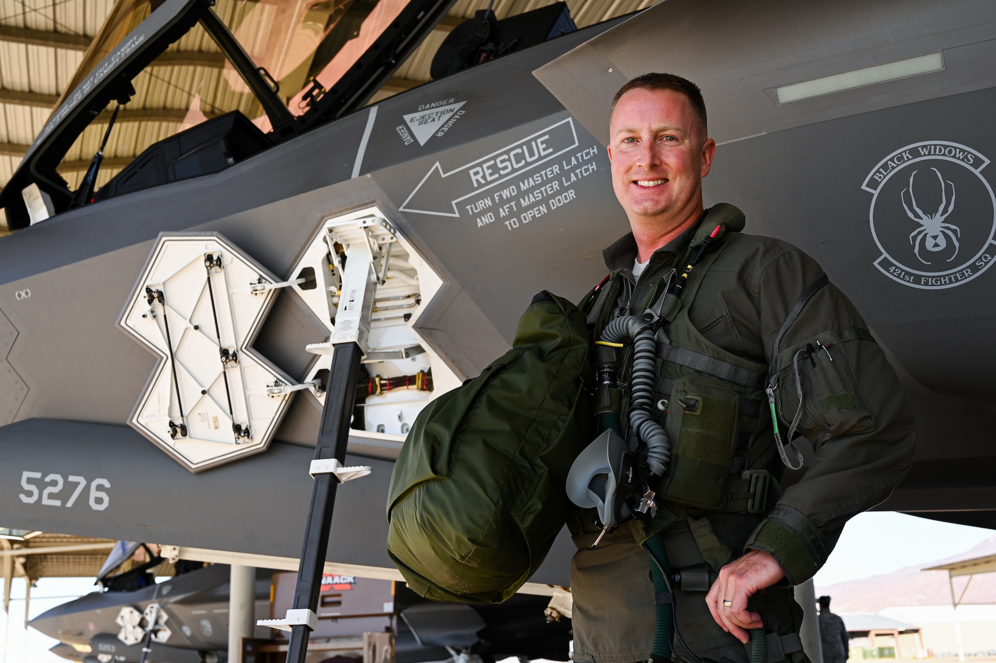 A photo of Lt. Col. Jared Santos. First Air Force pilot to reach 1,000 hours in the F-35A Lightning II