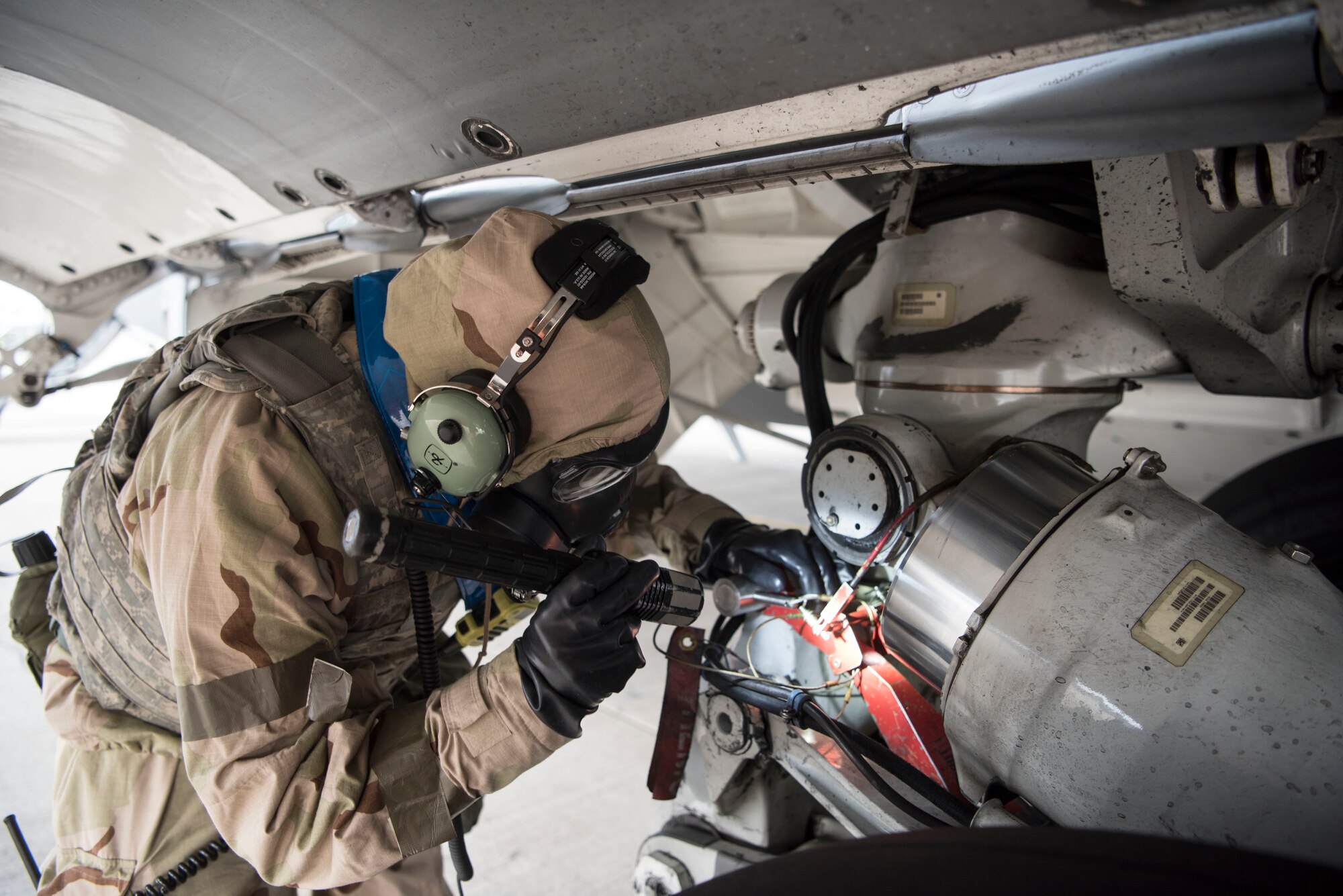 U.S. Air Force Tech Sgt. Ivan Sawyer, 721st Aircraft Maintenance Squadron aircraft craftsman, inspects a hydraulic system on a U.S. Air Force C-17 Globemaster III aircraft