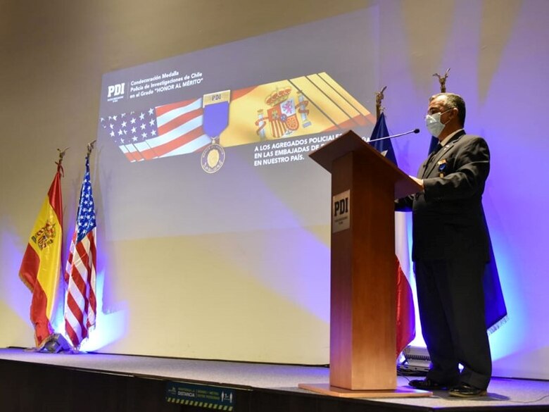 Office of Special Investigations Special Agent in Charge Carlos Vargas, Force Protection Detachment 7, Santiago, Chile, delivers thank you remarks Oct. 13, 2020, upon receiving that country's   Policia de Investigaciones (PDI - Investigative Police) Honor of Merit Award for his distinguished performance as an attache of the United States Embassy. (Photo by Pedro Pablo Alvarez, PDI)