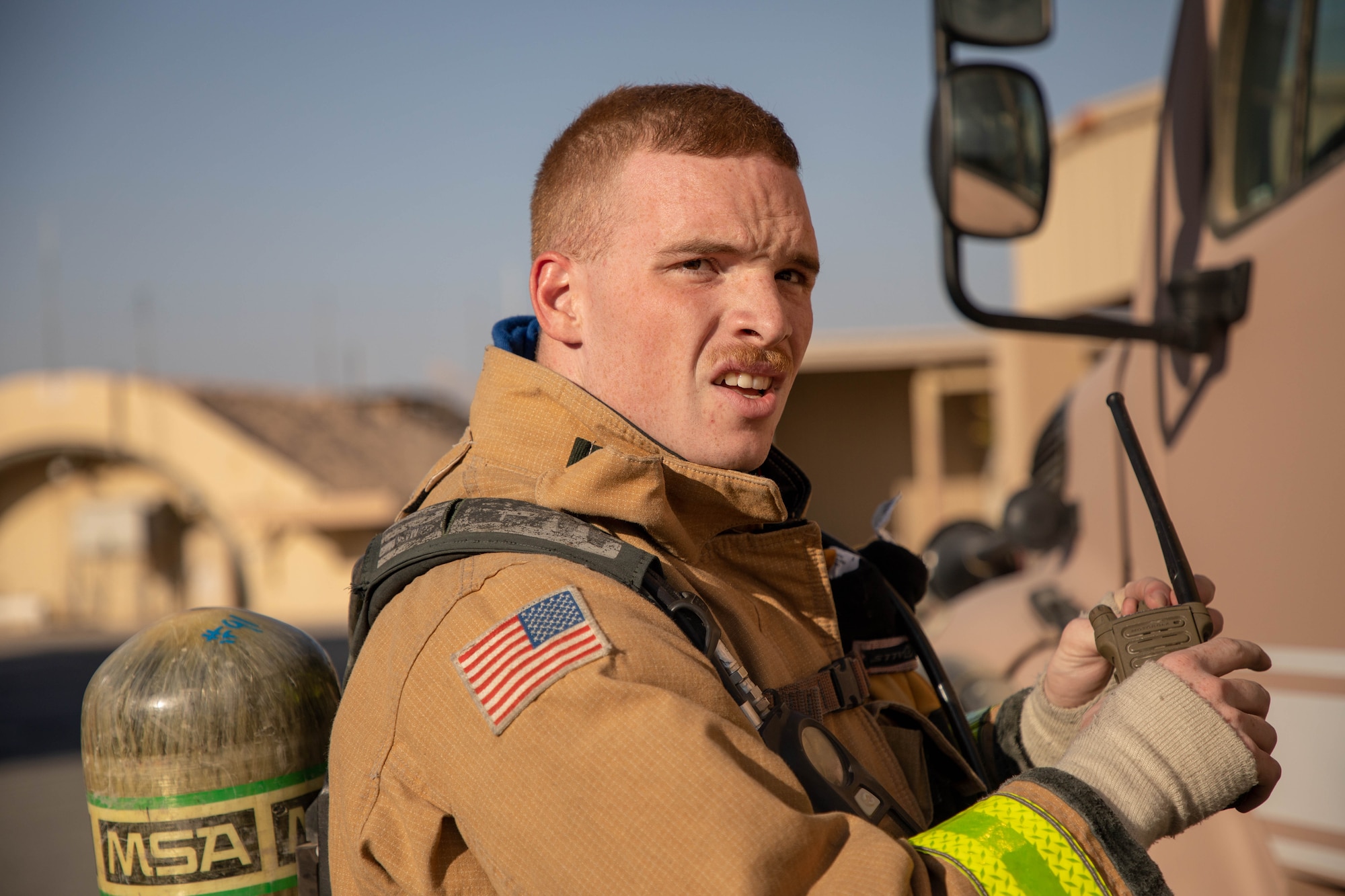 U.S. Air Force Staff Sgt. Michael Coleman, 386th Expeditionary Civil Engineer Squadron crew chief, relays fire and medical evacuation information during the Air and Missile Defense Exercise 21-1 at Ali Al Salem Air Base, Kuwait, Oct. 22, 2020.