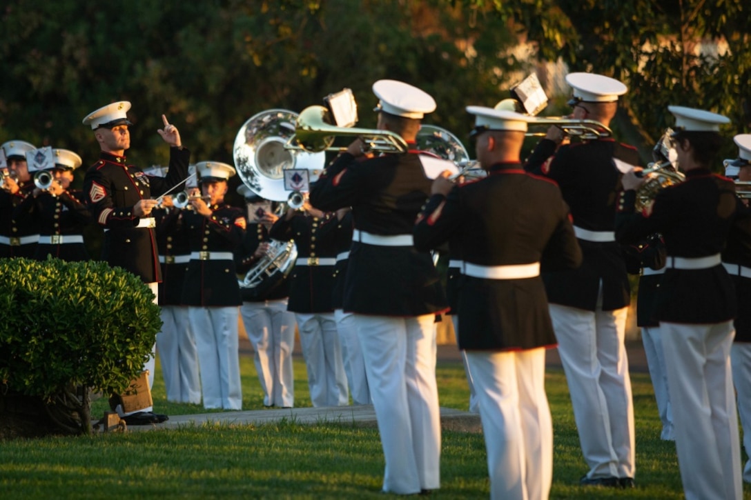 U.S. Marines with the 1st Marine Division Band perform during the 78th Annual Evening Colors  Ceremony at the San Margarita Ranch House on Marine Corps Base Camp Pendleton, California,  Sept. 29, 2020. The ceremony was held to commemorate the official dedication of Camp Pendleton,  which took place in September 1942. The base was named after Maj. Gen. Joseph H. Pendleton,  who had long advocated for a West Coast training base to be established. (U.S. Marine Corps photo  by Lance Cpl. Kerstin Roberts)