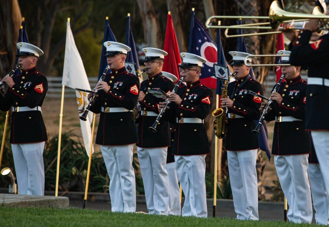 U.S. Marines with the 1st Marine Division Band perform during the 78th Annual Evening Colors  Ceremony at the San Margarita Ranch House on Marine Corps Base Camp Pendleton, California,  Sept. 29, 2020. The ceremony was held to commemorate the official dedication of Camp Pendleton,  which took place in September 1942. The base was named after Maj. Gen. Joseph H. Pendleton,  who had long advocated for a West Coast training base to be established. (U.S. Marine Corps photo  by Lance Cpl. Kerstin Roberts)