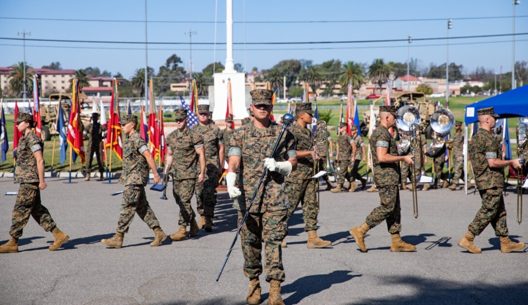 U.S. Marines with the 1st Marine Division (1st MARDIV) Band perform during the 1st MARDIV  commanding general change of command ceremony held at Marine Corps Base Camp Pendleton,  California, Sept. 22, 2020. The ceremony represented the transfer of responsibility, authority and  accountability from Maj. Gen. Robert F. Castellvi, the outgoing commanding general, to Maj. Gen.  Roger B. Turner, Jr. (U.S. Marine Corps photo by Cpl. Jailine L. AliceaSantiago)