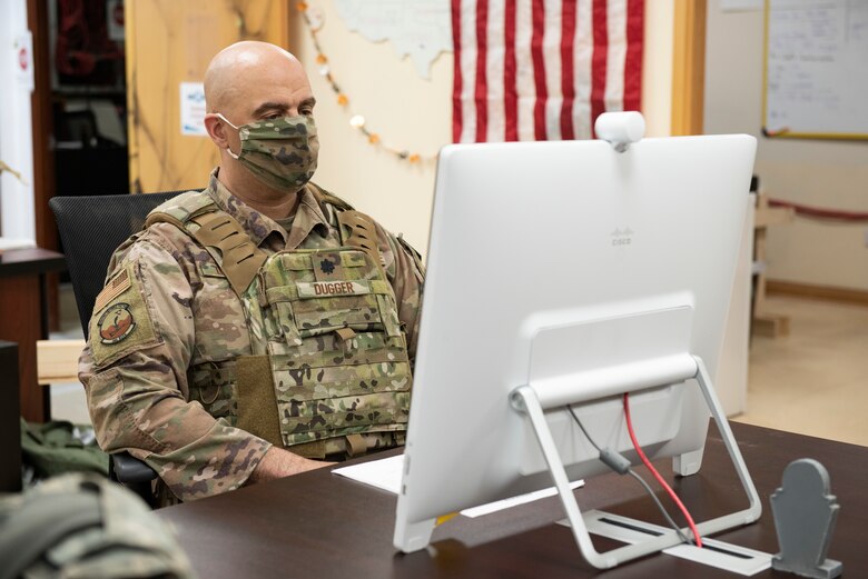 U.S. Air Force Lt. Col. Yon Dugger, 386th Expeditionary Security Forces Squadron commander, talks with leadership during the Air and Missile Defense Exercise 21-1 at Ali Al Salem Air Base, Kuwait, Oct. 22, 2020.