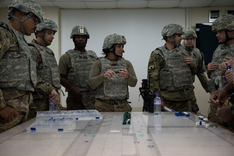 U.S. Air Force Airmen from the 386th Expeditionary Civil Engineer Squadron prepare a tabletop exercise in response to a simulated attack during the Air and Missile Defense Exercise 21-1 at Ali Al Salem Air Base, Kuwait, Oct. 22, 2020.