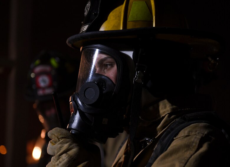 U.S. Air Force Staff Sgt. Breanna Carden, 386th Expeditionary Civil Engineer Squadron station captain, speaks into a radio during the Air and Missile Defense Exercise 21-1 at Ali Al Salem Air Base, Kuwait, Oct. 22, 2020.