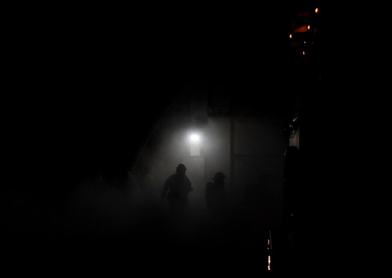 Firefighters assigned to the 386th Expeditionary Civil Engineer Squadron arrive on scene at a simulated fire during the Air and Missile Defense Exercise 21-1 at Ali Al Salem Air Base, Kuwait, Oct. 22, 2020.