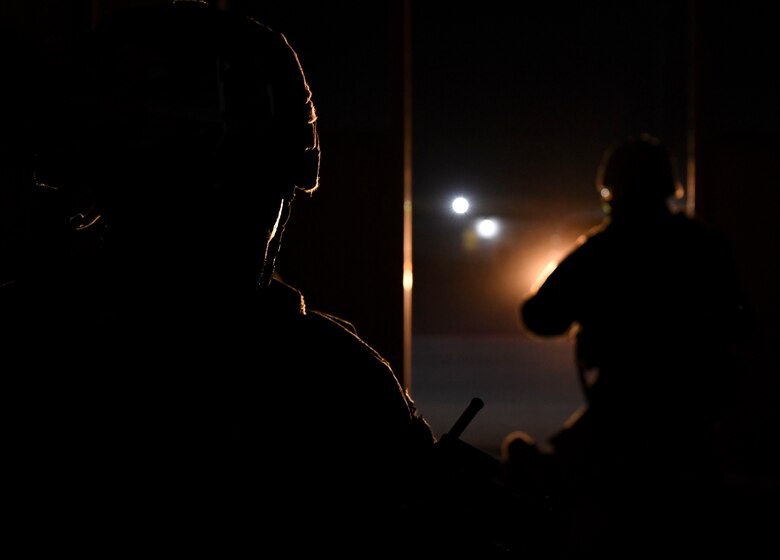 U.S. Air Force Tech. Sgt. Adam Smith, and Tech. Sgt. Joshua Alvarez, 386th Expeditionary Security Forces Squadron raptor flight patrolmen, wait for additional emergency responders during the Air and Missile Defense Exercise 21-1 at Ali Al Salem Air Base, Kuwait, Oct. 22, 2020.