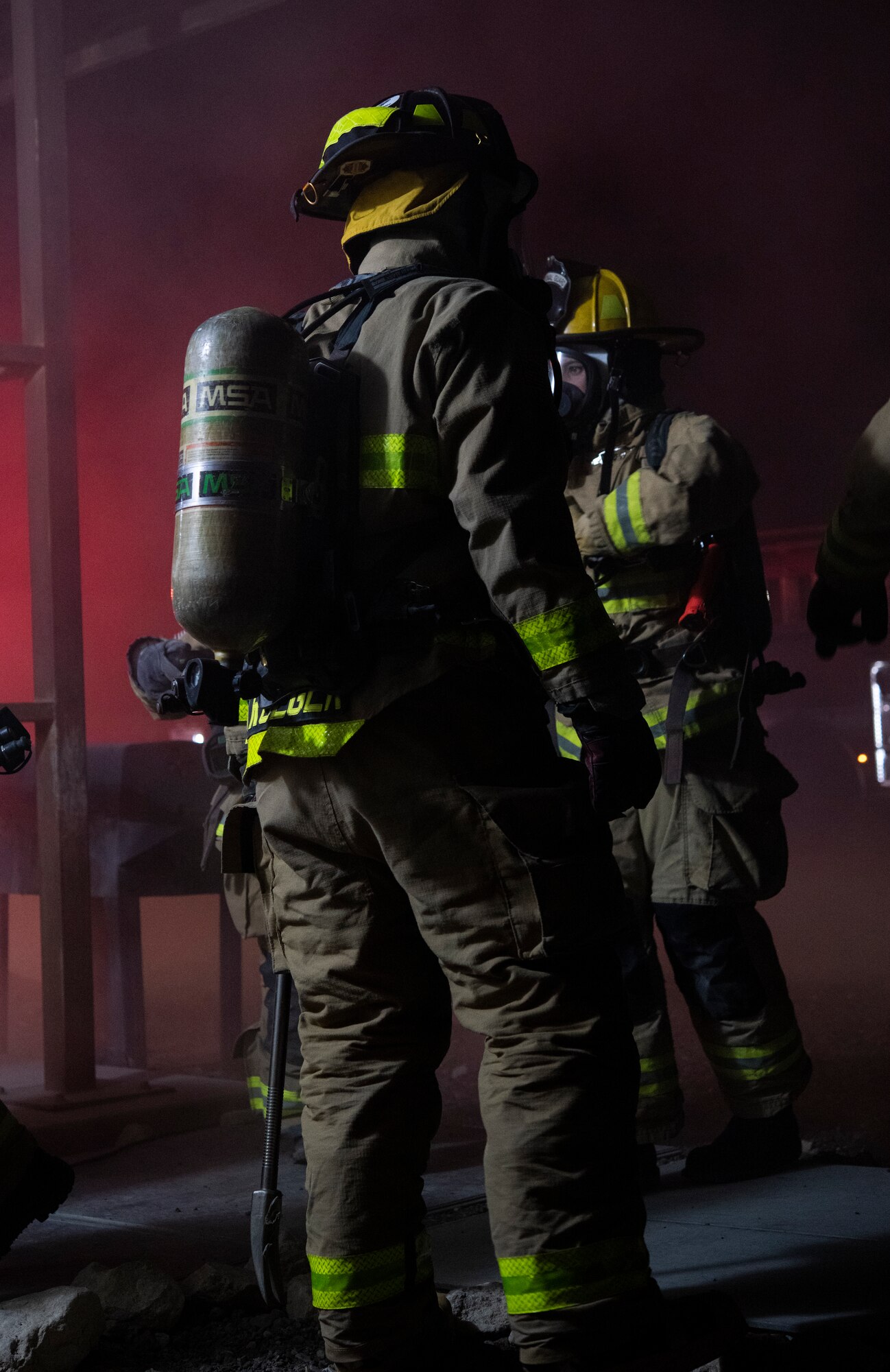 A U.S. Air Force firefighter assigned to the 386th Civil Engineer Squadron prepares to enter a building during the Air and Missile Defense Exercise 21-1 at Ali Al Salem Air Base, Kuwait, Oct. 22, 2020.