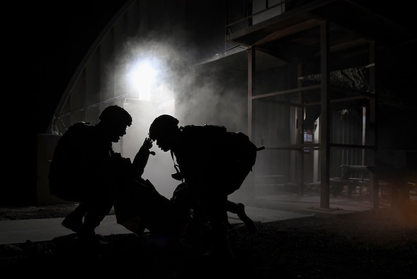 U.S. Air Force Lt. Col. Yon Dugger, 386th Expeditionary Security Forces Squadron commander, talks with leadership during the Air and Missile Defense Exercise 21-1 at Ali Al Salem Air Base, Kuwait, Oct. 22, 2020.