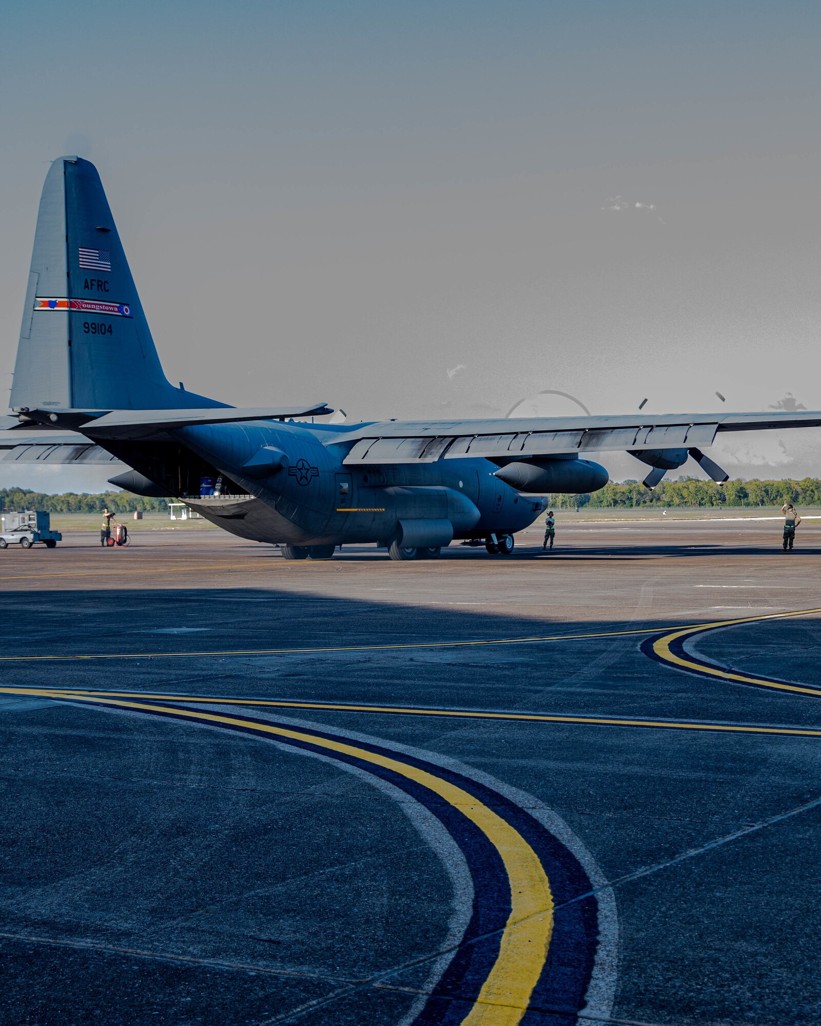 A U.S. Air Force Reserve C-130H Hercules aircraft assigned to the 910th Airlift Wing, based at Youngstown Air Reserve Station, Ohio, and equipped with a Modular Aerial Spray System, starts engines prior to taking off from Barksdale Air Force Base, Louisiana, Oct. 22, 2020.