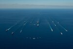 U.S. Navy ships assigned to the Ronald Reagan Carrier Strike Group join ships of Japan Maritime Self-Defense Force (JMSDF) Escort Flotilla 1, Escort Flotilla 4, and the Royal Canadian Navy in formation while aircraft from the U.S. Navy, U.S. Marine Corps, U.S. Air Force, JMSDF and Japan Air Self-Defense Force fly overhead during exercise Keen Sword, Oct. 26.