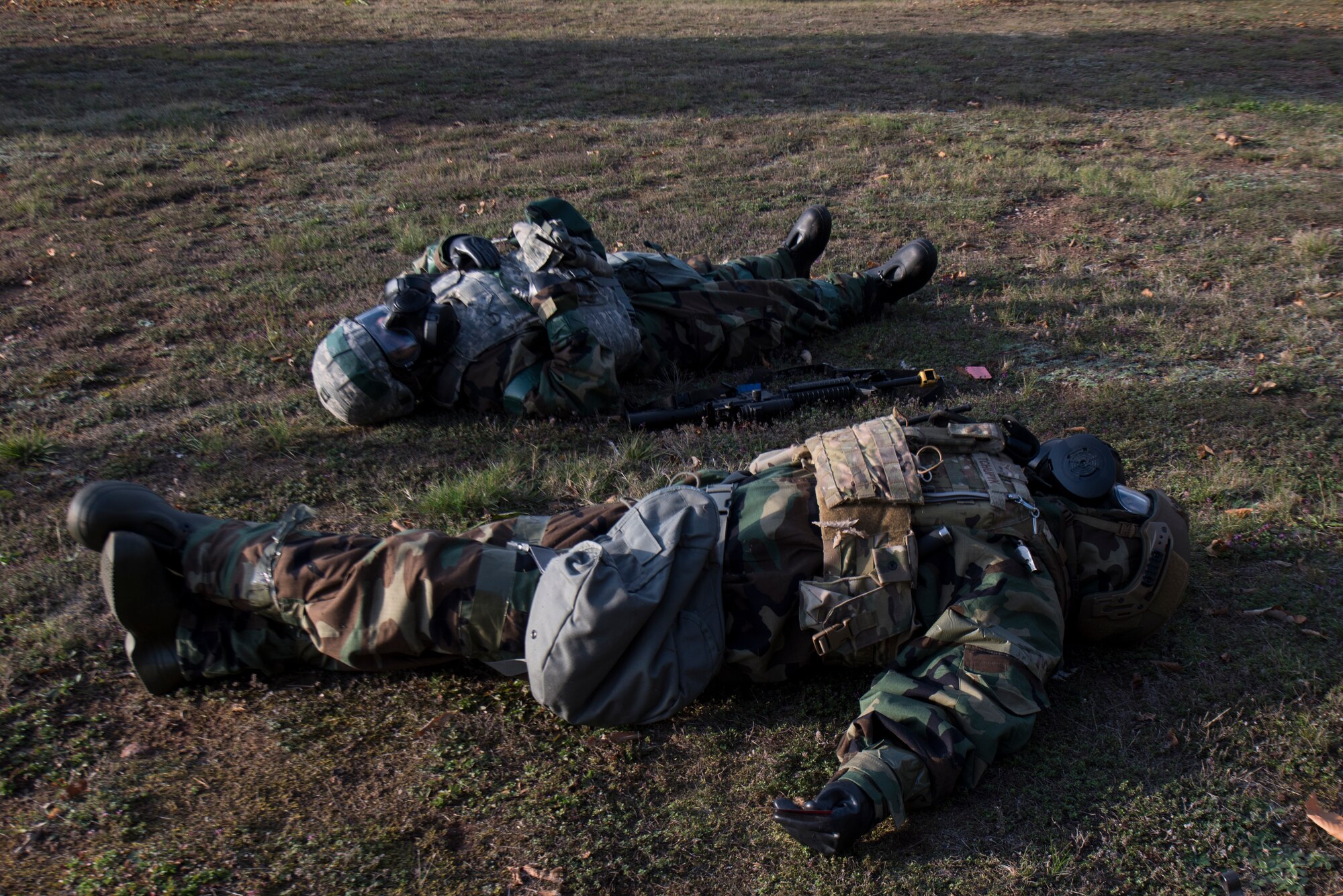 Two Airmen act as victims during an exercise Operation Varsity exercise.