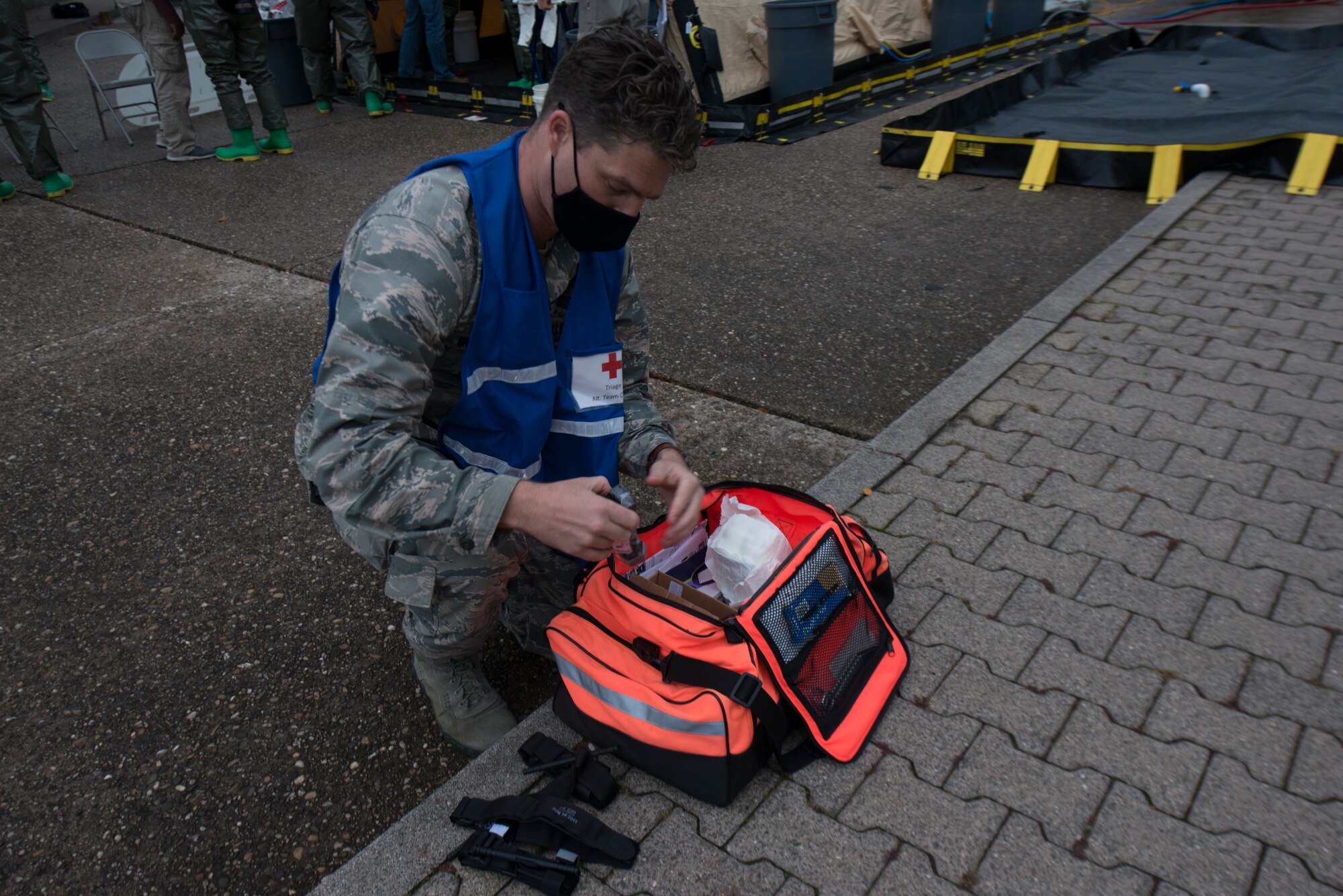 An Airmen obtains medical supplies.