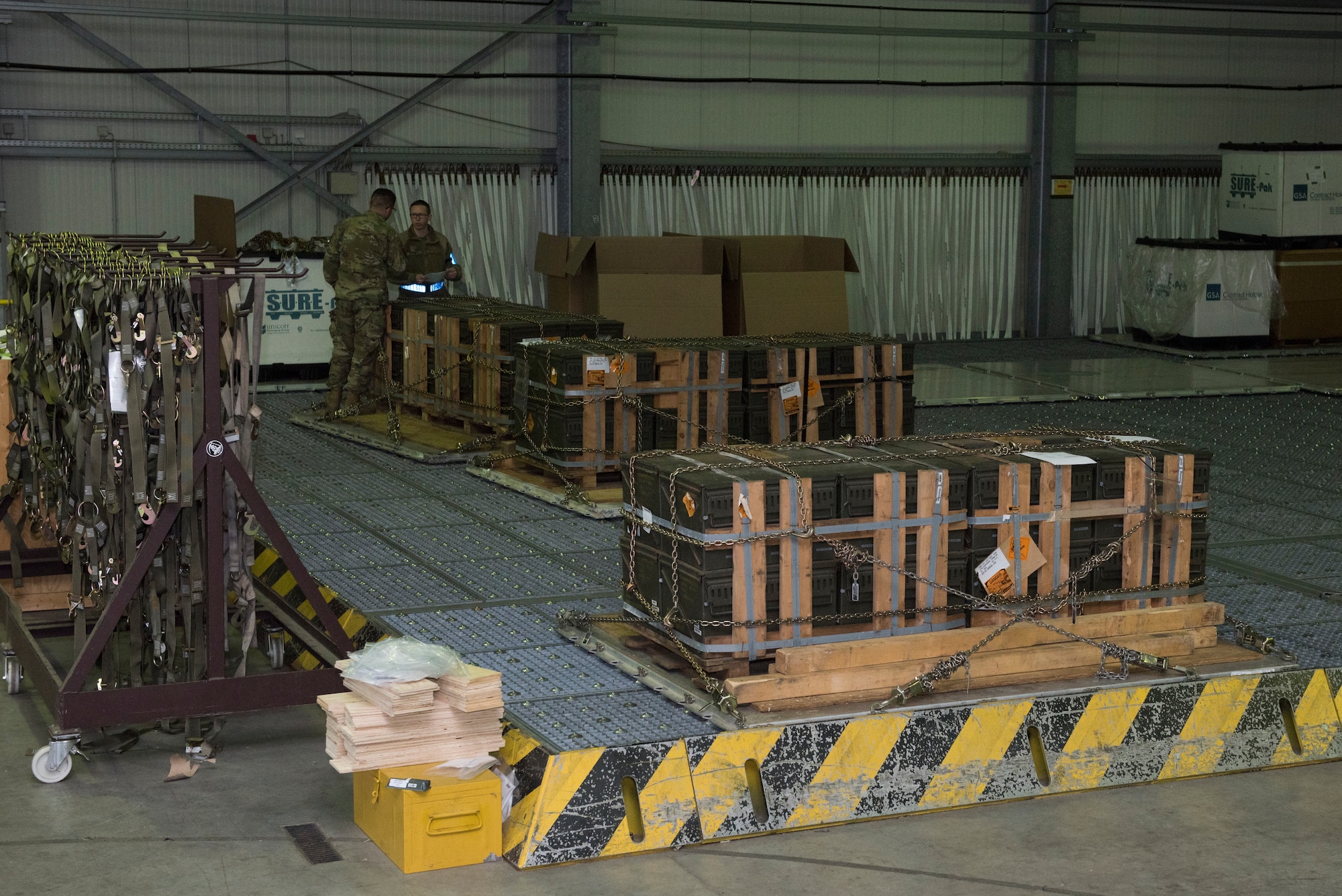 Ammunition pallets rest on weight scales.