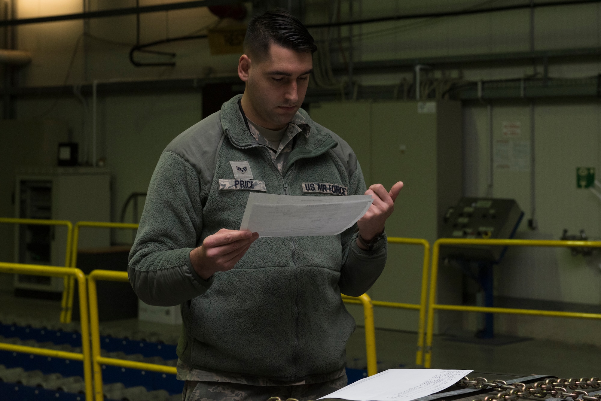 An Airman checks documents.