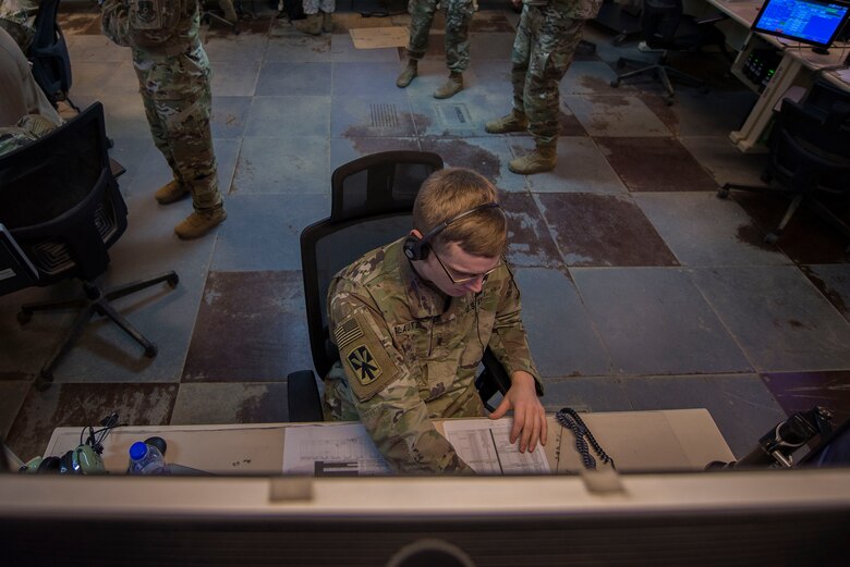 U.S. Army 1st Lt. Andrew Plautz, 11th Air Defense Artillery (ADA) Brigade ADA fire control officer, monitors information during Air Missile and Defense Exercise (AMDEX) 21-1 at Al Dhafra Air Base, United Arab Emirates, Oct. 23, 2020.