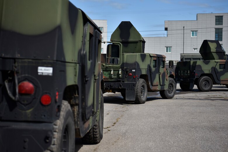 A photo of multiple Humvees before inspection.