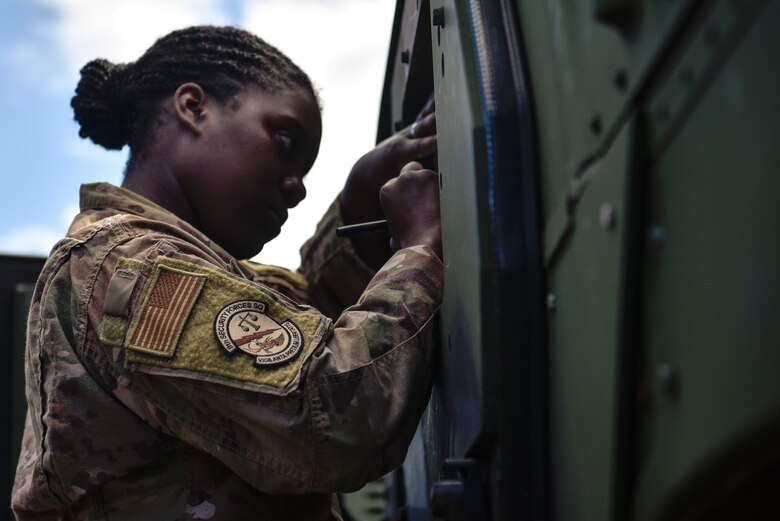 A photo of an Airman filling out paperwork.