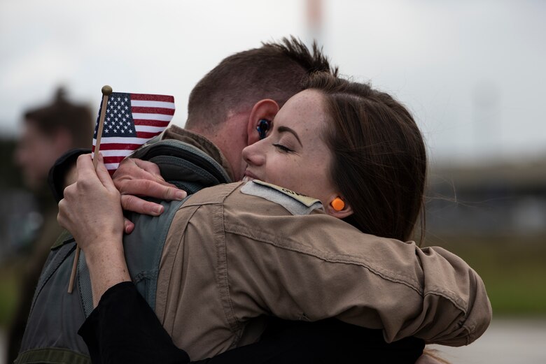 F-15E Strike Eagle aircrew assigned to the 492nd Fighter Squadron reunite with their families at Royal Air Force Lakenheath, England, Oct. 15, 2020. The 492nd FS returned from a six-month deployment in support of U.S. Air Force Central Command. (U.S. Air Force photo by Airman 1st Class Jessi Monte)