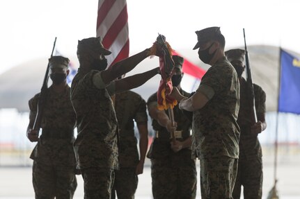 U.S. Marine Corps Sgt. Maj. Idris Turray, left, Sergeant Major of Marine All Weather Fighter Attack Squadron (VMFA(AW)) 242, and Lt. Col. Andrew Kelemen, commanding officer of VMFA(AW)-242, retire the colors at Marine Corps Air Station Iwakuni, Japan, Oct. 16, 2020.