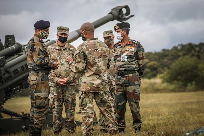 201019-A-PO701-212 - SCHOFIELD BARRACKS, Hawaii (Oct. 19, 2020) --  25th Infantry Division briefs Lt. Gen. S K Saini, Vice Chief of the Army Staff of the Indian Army on an air assault operation with a CH-47 Chinook carrying a sling load with a M777 Howitzer on Schofield Barracks East Range, Hawaii, on Oct. 19, 2020.