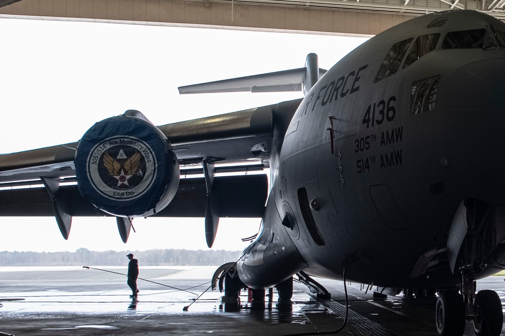 Photo of an aircraft wash specialist preparing to clean a C-17 Globemaster III.