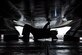 Photo of an aircraft wash specialist cleaning the underside of a C-17 Globemaster III.