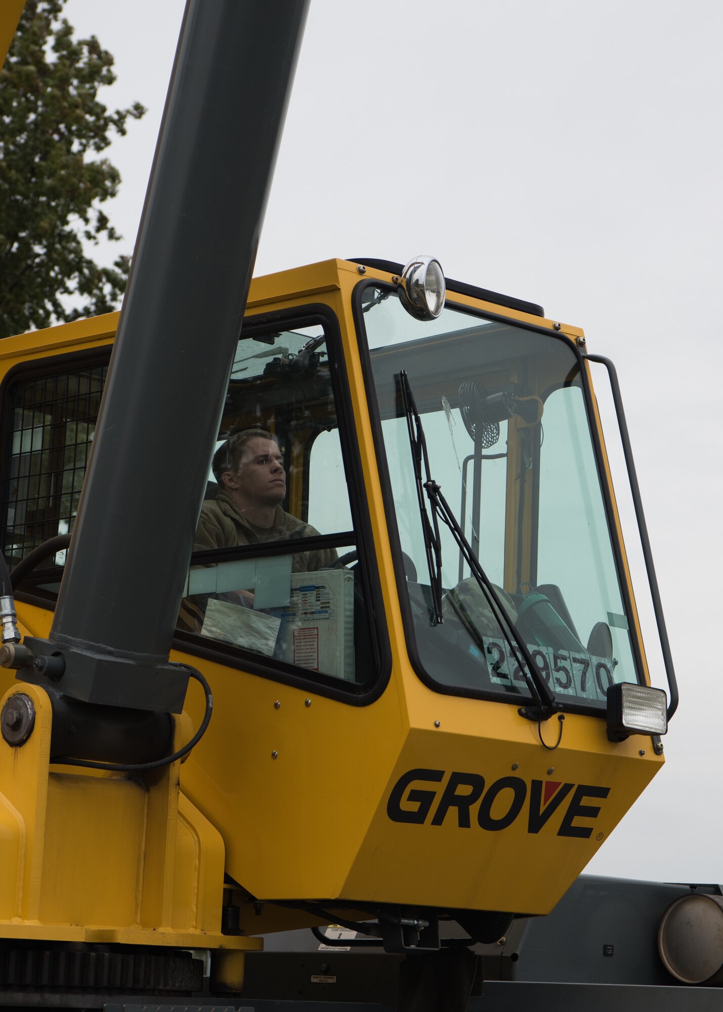 Staff Sergeant Christopher Cunningham, 131st Maintenance Squadron aero repair technician, operates a 50 ton crane to lift the B-2 static display.