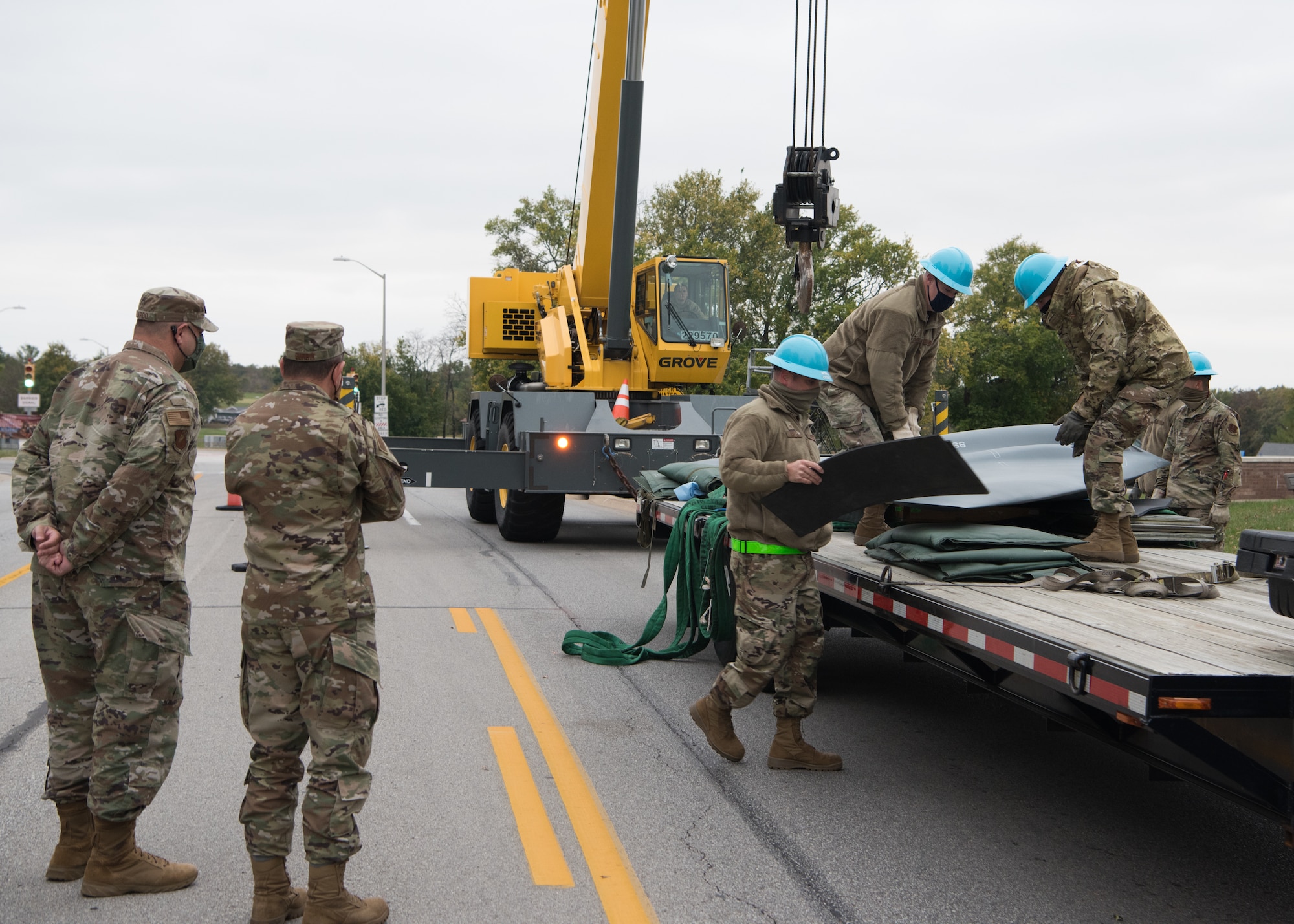 Airmen prepare the B-2 static display to be lifted with the 50 ton crane while 131st Maintenance Group leadership observes their work.