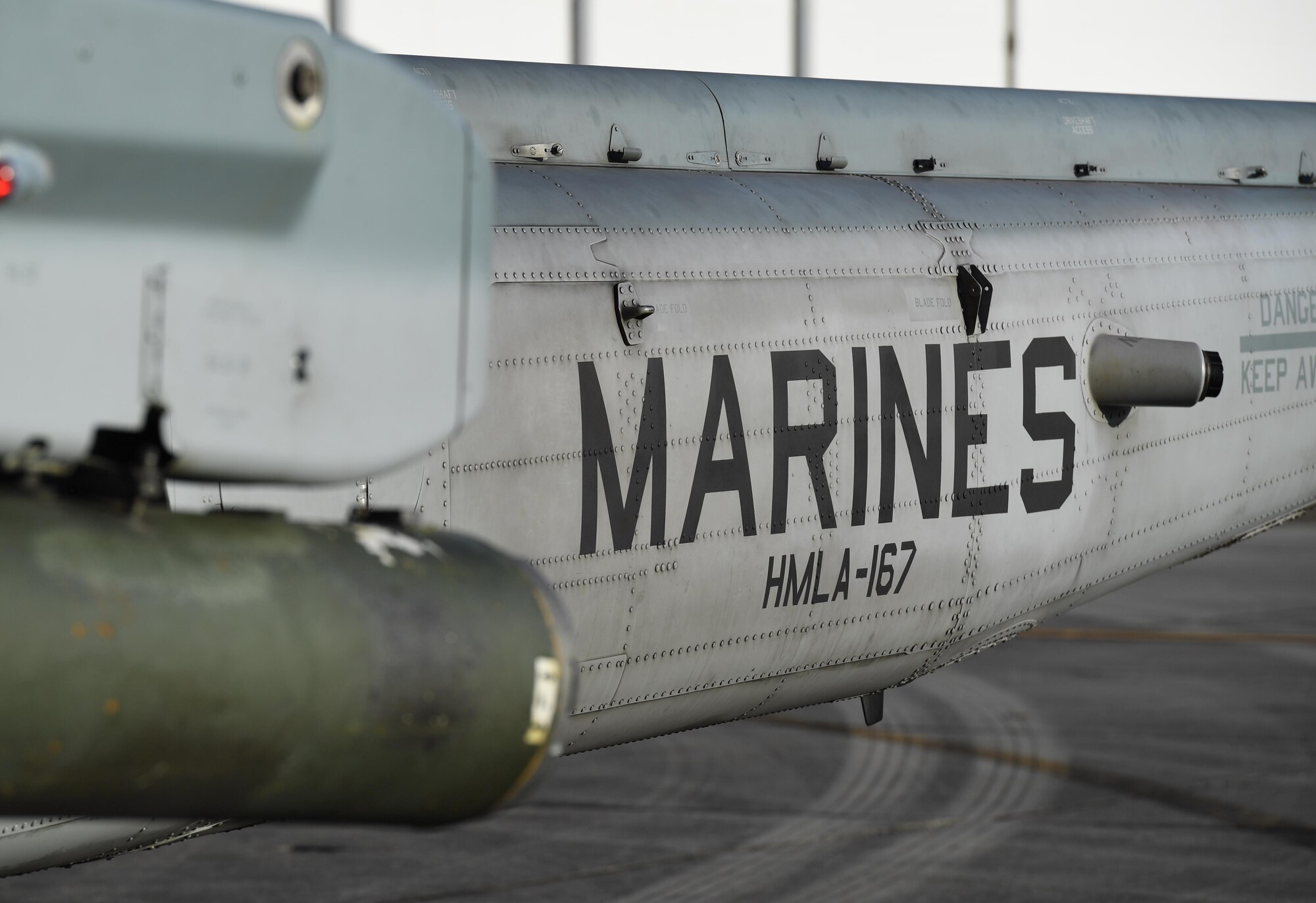 An AH-1Z Cobra, Marine Light Attack Helicopter Squadron 167, Marine Corps Air Station New River, North Carolina, is displayed on the flightline at Keesler Air Force Base, Mississippi, Oct. 21, 2020. Two AH-1Z Cobras and two UH-1Y Hueys were at Keesler for joint training with the Marine Special Operations Command during their RAVEN exercise from Oct. 12-21. RAVEN is the exercise Marine Raiders complete after their six-month training cycle in preparation for deployment to ensure operational readiness of the Marine Special Operations Teams. (U.S. Air Force photo by Kemberly Groue)