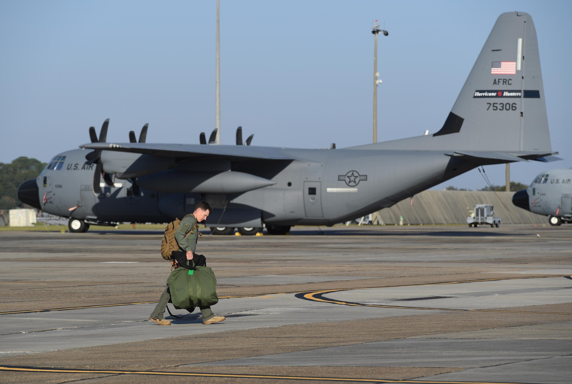 U.S. Marine Corps Capt. Edward Ross, Marine Light Attack Helicopter Squadron 167 AH-1Z Cobra pilot, Marine Corps Air Station New River, North Carolina, walks on the flightline at Keesler Air Force Base, Mississippi, Oct. 21, 2020. Two AH-1Z Cobras and two UH-1Y Hueys were at Keesler for joint training with the Marine Special Operations Command during their RAVEN exercise from Oct. 12-21. RAVEN is the exercise Marine Raiders complete after their six-month training cycle in preparation for deployment to ensure operational readiness of the Marine Special Operations Teams. (U.S. Air Force photo by Kemberly Groue)