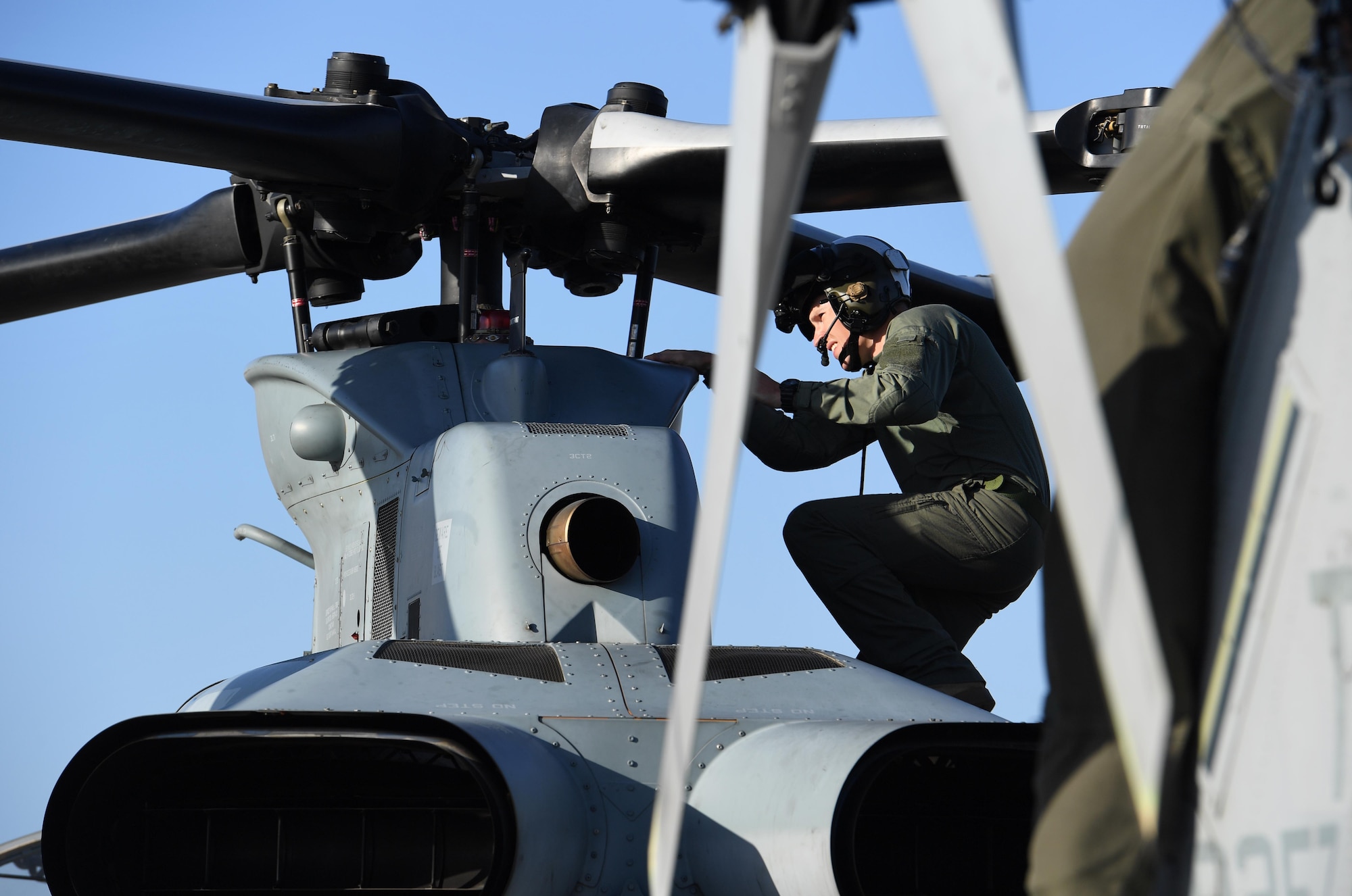 U.S. Marine Corps Capt. Edward Ross, Marine Light Attack Helicopter Squadron 167 AH-1Z Cobra pilot, Marine Corps Air Station New River, North Carolina, conducts a pre-flight inspection on an AH-1Z Cobra at Keesler Air Force Base, Mississippi, Oct. 21, 2020. Two AH-1Z Cobras and two UH-1Y Hueys were at Keesler for joint training with the Marine Special Operations Command during their RAVEN exercise from Oct. 12-21. RAVEN is the exercise Marine Raiders complete after their six-month training cycle in preparation for deployment to ensure operational readiness of the Marine Special Operations Teams. (U.S. Air Force photo by Kemberly Groue)