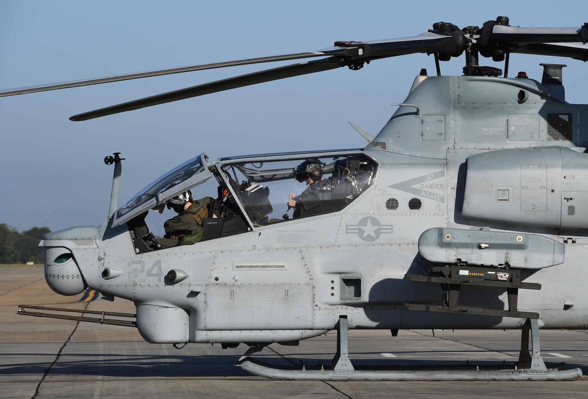 U.S. Marine Corps Capts. Edward Ross and Jeffrey Jaeckel, Marine Light Attack Helicopter Squadron 167 AH-1Z Cobra pilots, Marine Corps Air Station New River, North Carolina, prepare to fly an AH-1Z Cobra at Keesler Air Force Base, Mississippi, Oct. 21, 2020. Two AH-1Z Cobras and two UH-1Y Hueys were at Keesler for joint training with the Marine Special Operations Command during their RAVEN exercise from Oct. 12-21. RAVEN is the exercise Marine Raiders complete after their six-month training cycle in preparation for deployment to ensure operational readiness of the Marine Special Operations Teams. (U.S. Air Force photo by Kemberly Groue)