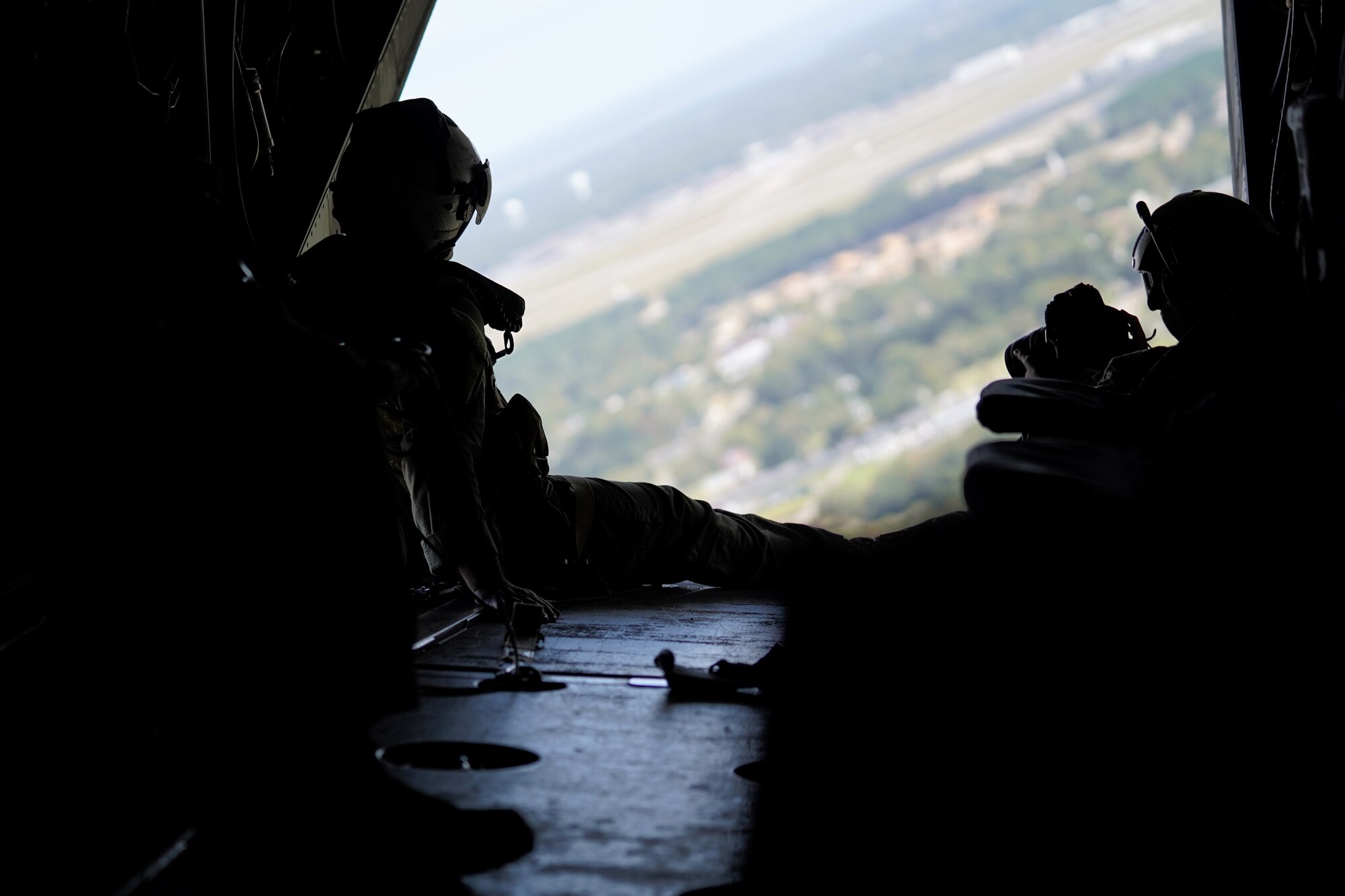 U.S. Marine Corps Staff Sgt. Jake Clark, Marine Medium Tiltrotor Squadron 774 MV-22B Osprey crew chief, Naval Air Station Norfolk, Virginia, sits on the back of a Osprey in a field in Columbia, Mississippi, Oct. 23, 2020. Marines came to Keesler to conduct routine training operations in and around the Mississippi area. (U.S. Air Force photo by Airman 1st Class Seth Haddix)