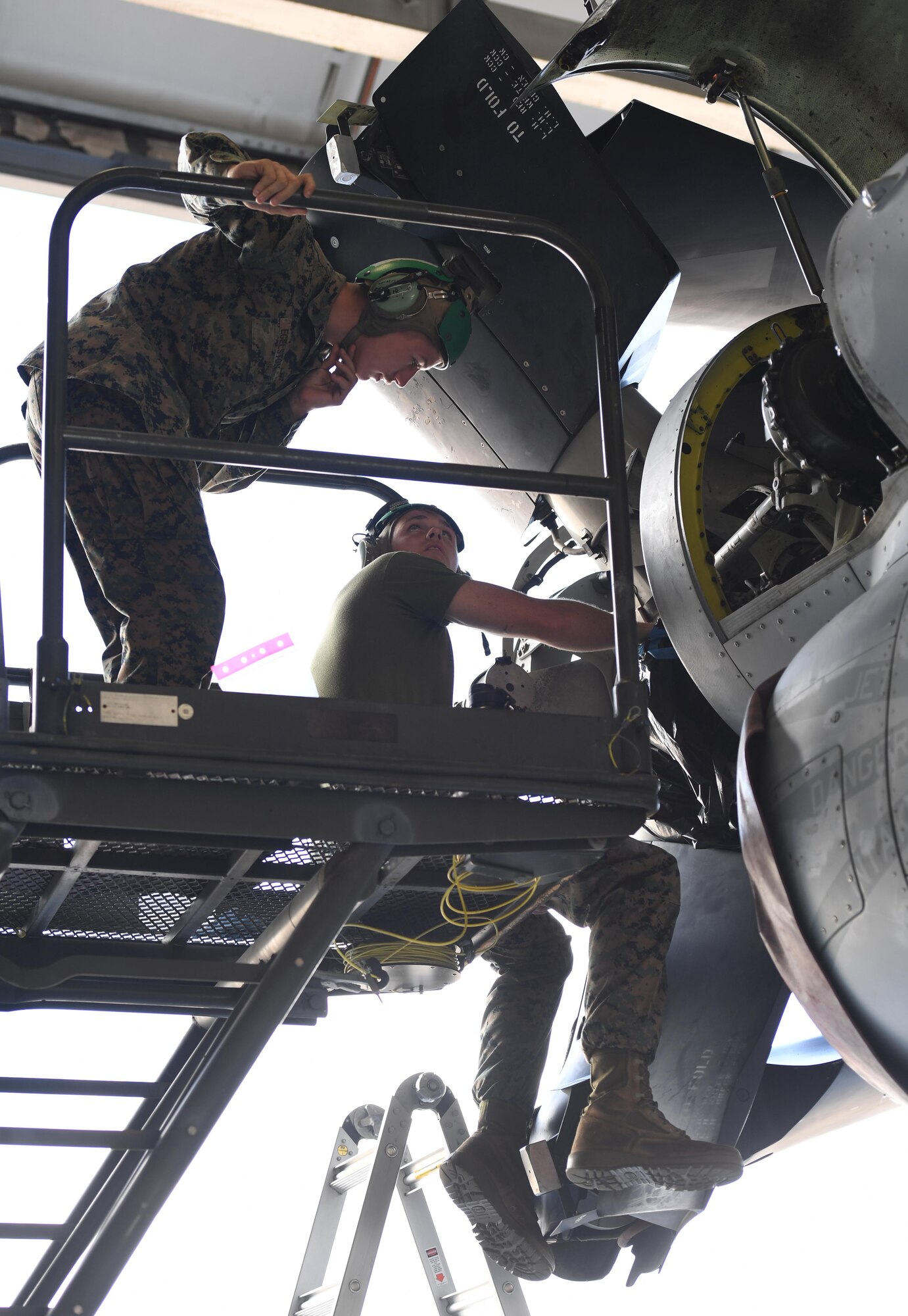 U.S. Marine Corps Lance Cpls. Jachob Egelston and Patrick Stanton, Marine Medium Tiltrotor Squadron 774 air framers, Naval Air Station Norfolk, Virginia, perform routine maintenance on an MV-22B Osprey inside a hangar at Keesler Air Force Base, Mississippi, Oct. 23, 2020. Marines came to Keesler to conduct routine training operations in and around the Mississippi area. (U.S. Air Force photo by Kemberly Groue)