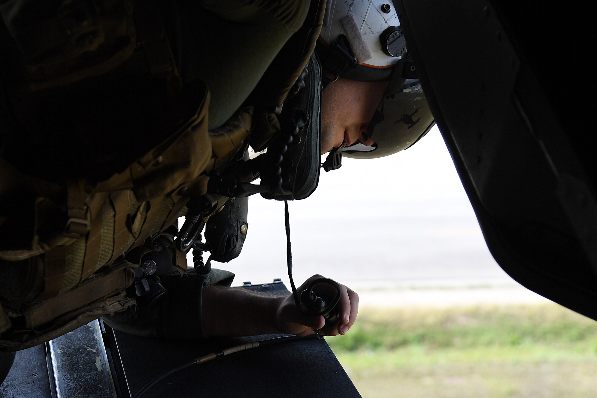 U.S. Marine Corps Staff Sgt. Jake Clark, Marine Medium Tiltrotor Squadron 774 MV-22B Osprey crew chief, Naval Air Station Norfolk, Virginia, watches the surroundings on the back of an MV-22B Osprey over Gulfport, Mississippi, Oct. 23, 2020. Marines came to Keesler to conduct routine training operations in and around the Mississippi area. (U.S. Air Force photo by Senior Airman Suzie Plotnikov)