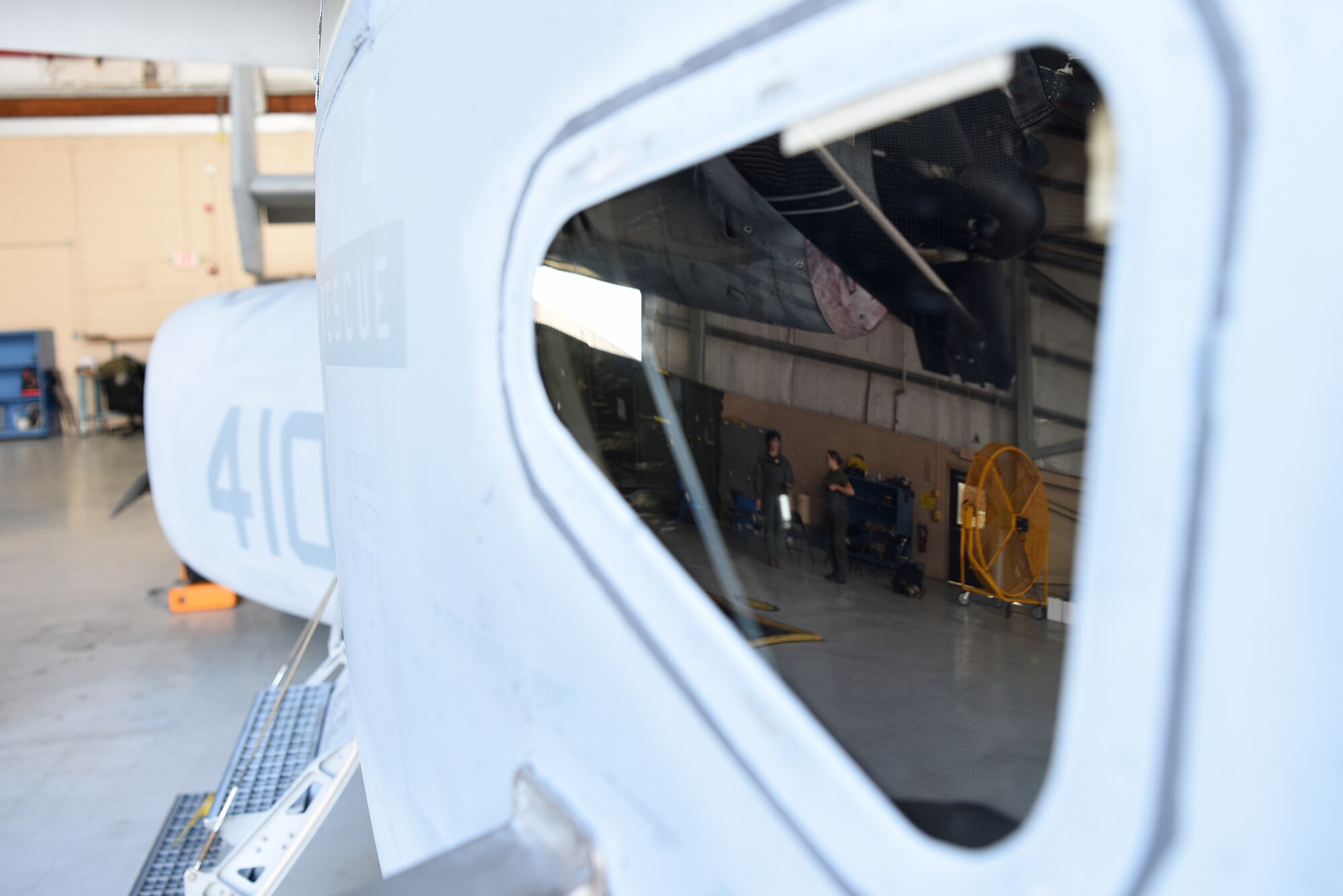 U.S. Marine Corps Lance Cpl. Porsha Delatte, Marine Medium Tiltrotor Squadron 774 avionics technician, Naval Air Station Norfolk, Virginia, and Sgt. Stephanie Fregoe, VMM-774 MV-22B Osprey crew chief, talk to each other inside a hangar at Keesler Air Force Base, Mississippi, Oct. 23, 2020. Marines came to Keesler to conduct routine training operations in and around the Mississippi area. (U.S. Air Force photo by Senior Airman Suzie Plotnikov)