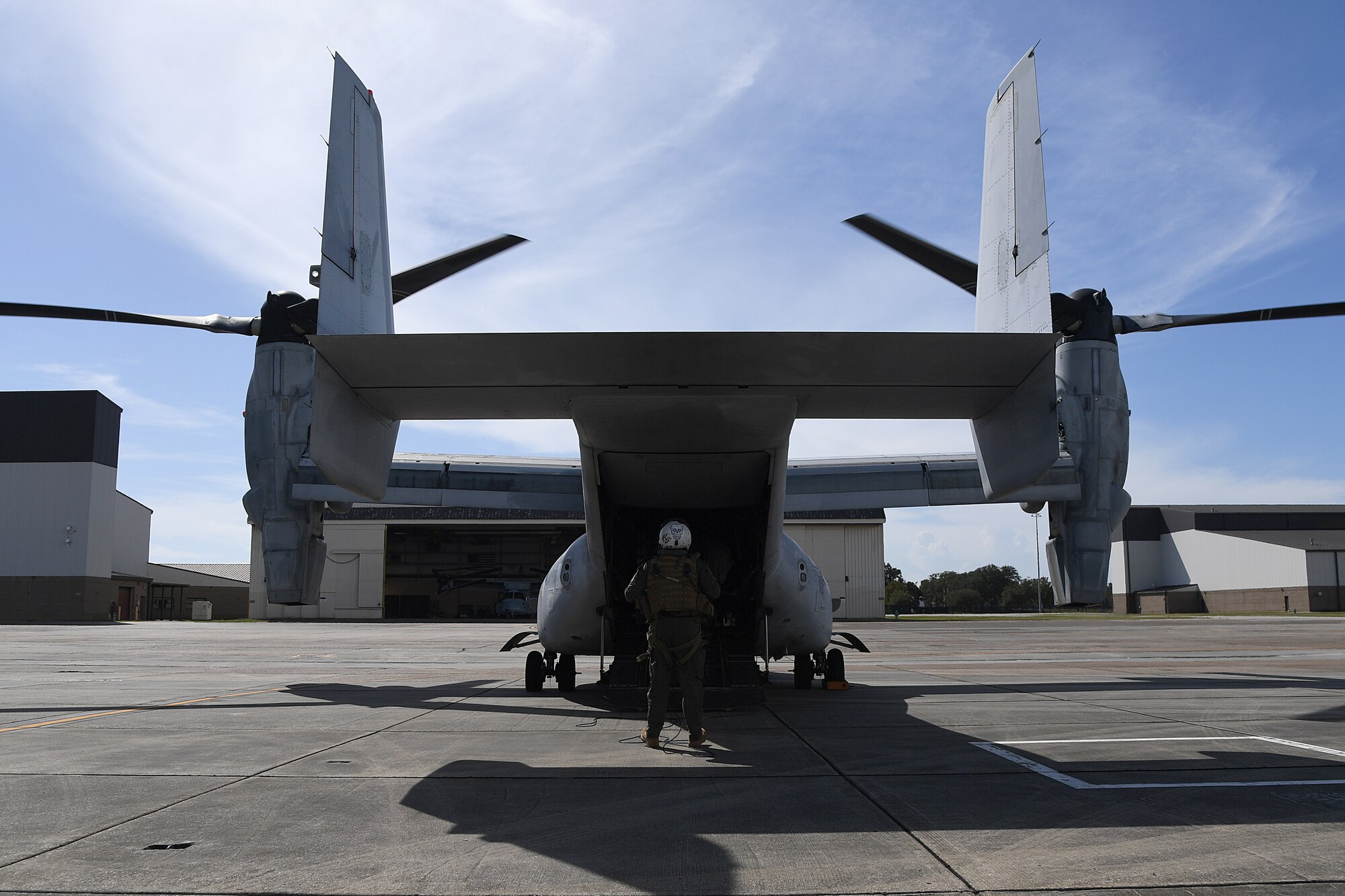 U.S. Marine Corps Staff Sgt. Jake Clark, Marine Medium Tiltrotor Squadron 774 MV-22B Osprey crew chief, Naval Air Station Norfolk, Virginia, performs a pre-flight inspection at Keesler Air Force Base, Mississippi, Oct. 23, 2020. Marines came to Keesler to conduct routine training operations in and around the Mississippi area. (U.S. Air Force photo by Senior Airman Suzie Plotnikov)