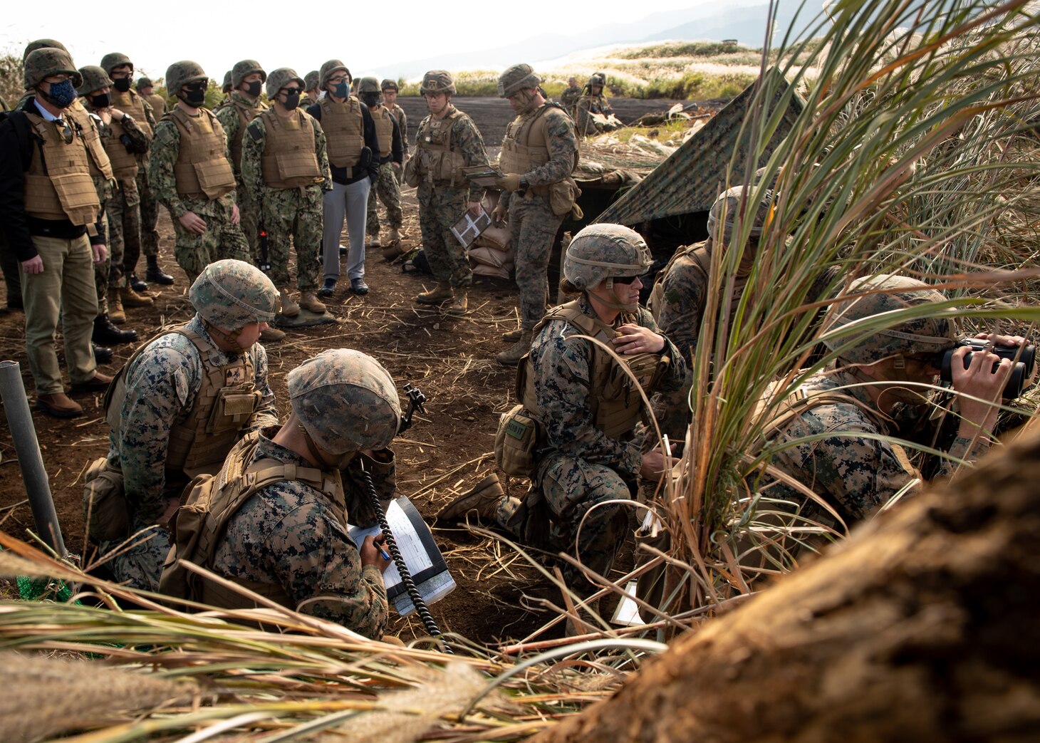 CAMP FUJI, Japan (Oct. 21, 2020) - Marines with 3rd Battalion, 12th Marine Regiment demonstrate communication procedures to members of 7th Fleet staff during Artillery Relocation Training Program 20.3 at Combined Arms Training Center, Camp Fuji. 7th Fleet serves with III MEF to continually execute missions that enable maritime superiority through effective command and control, prosecution of naval fires, and operational maneuvers.