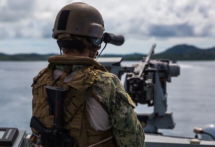 Sailor assigned to Commander, Task Force 75 (CTF 75) observes his surroundings during a security patrol aboard a Patrol Boat (PB) Mk VI during maritime operations.