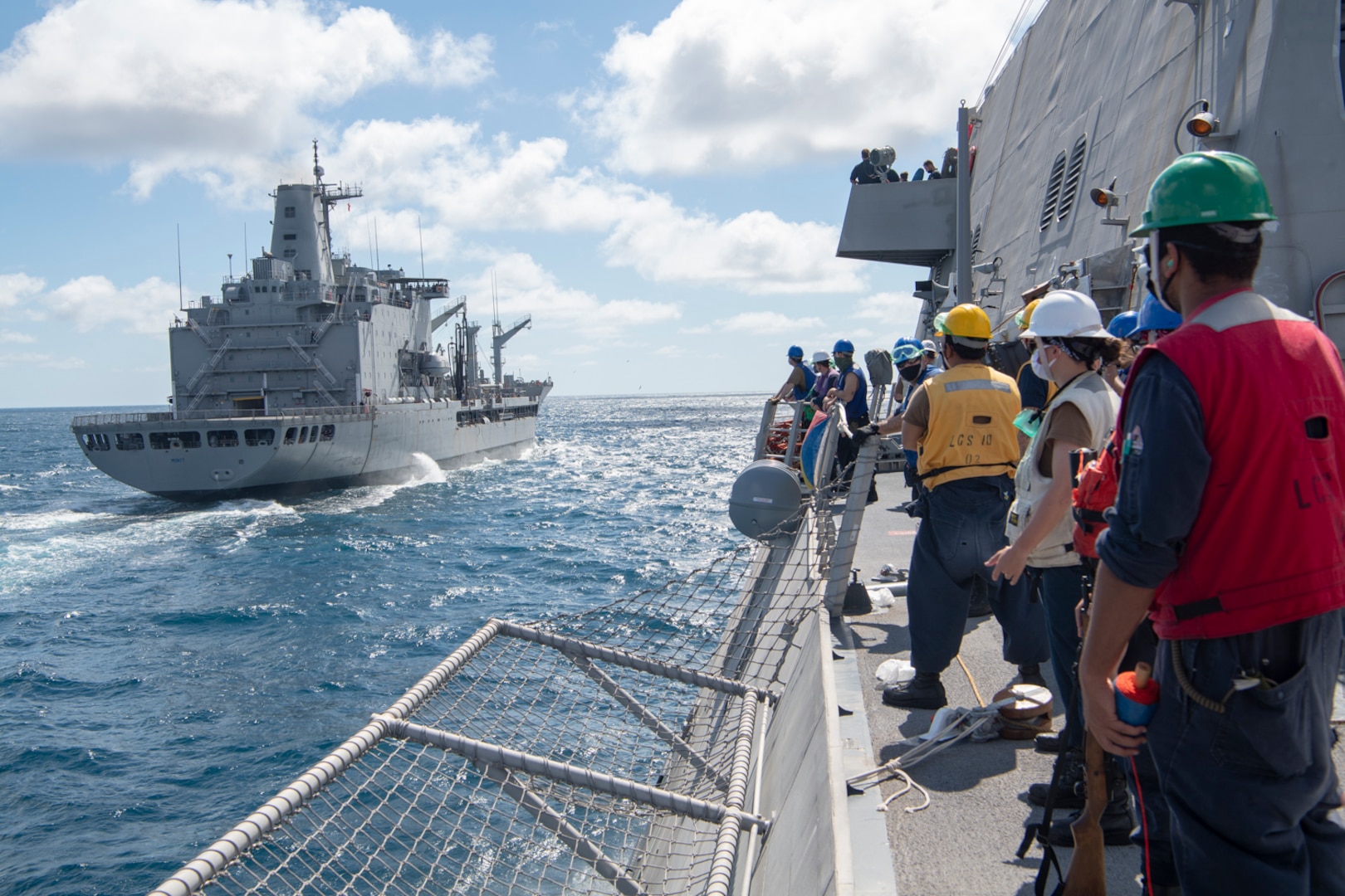 The Independence-variant littoral combat ship USS Gabrielle Giffords (LCS 10) conducts a replenishment-at-sea (RAS) with the Chilean navy replenishment oiler CNS Almirante Montt (AO-52).