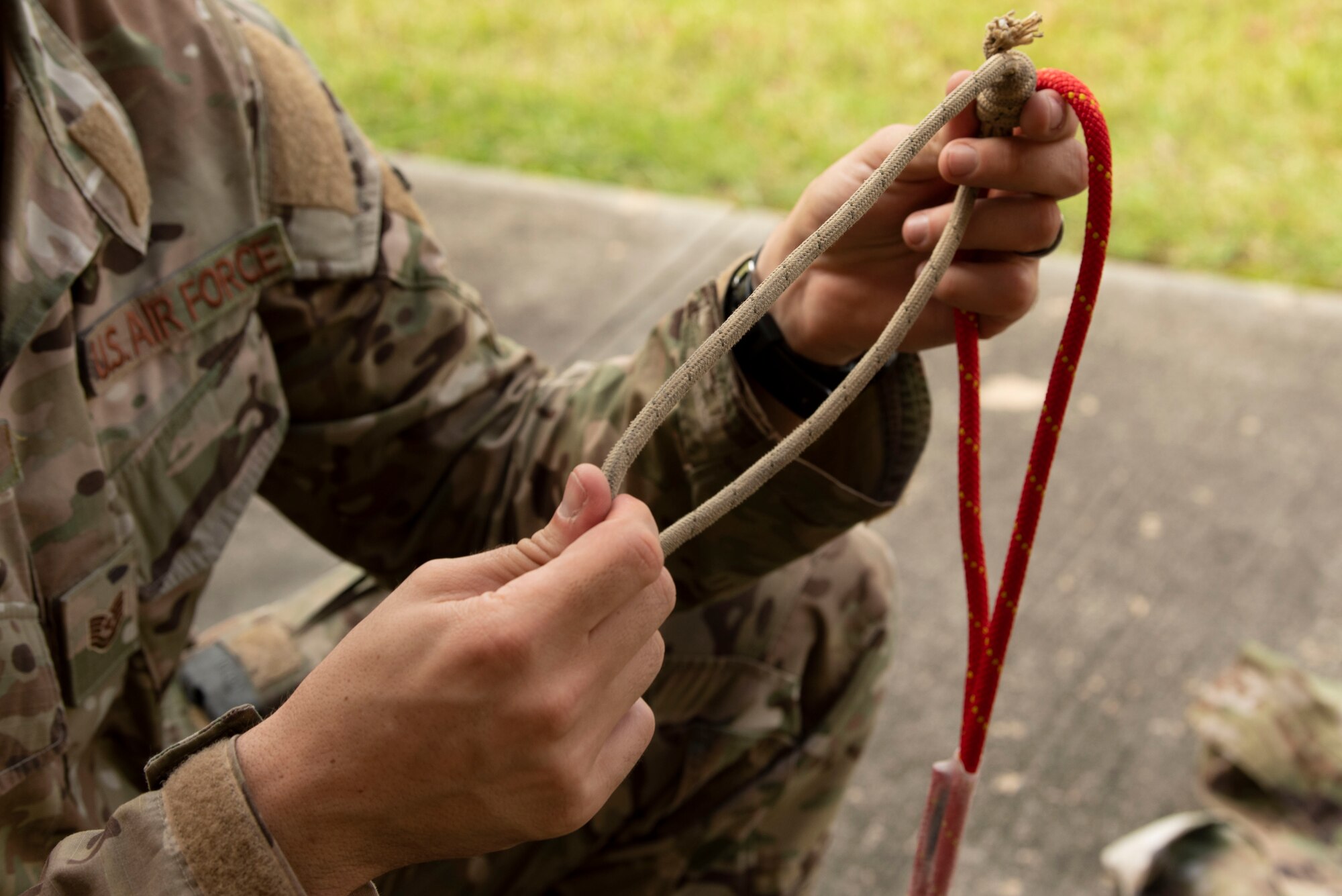 A photo of an Airman handling equipment.