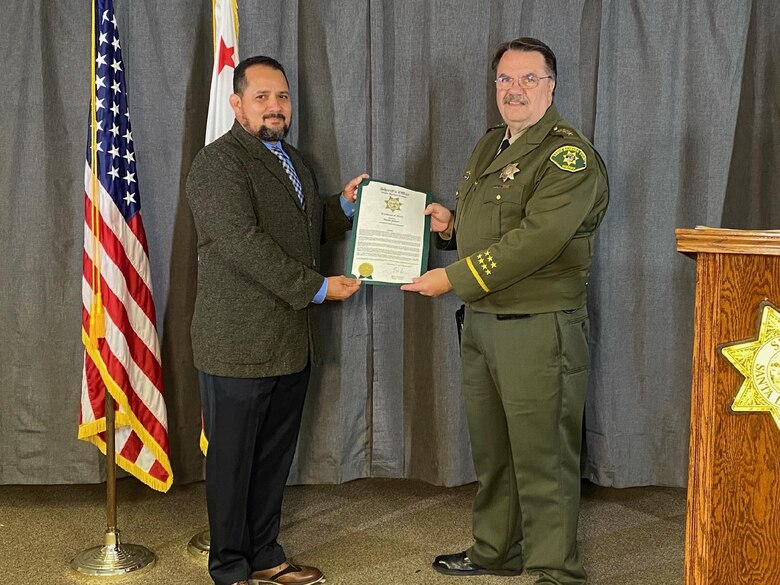 Photo of Mr Edgardo Coronado receiving certificate