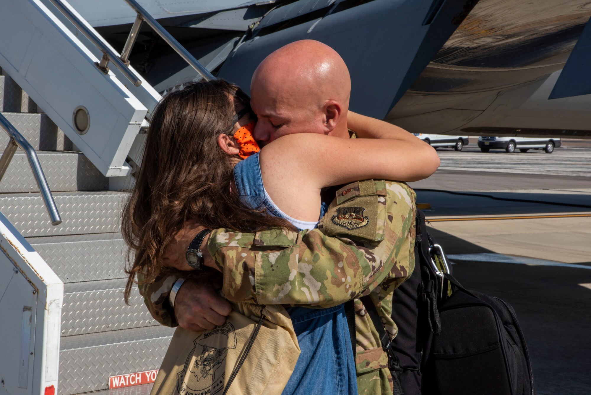 U.S Air Force Lt. Col. Ricardo Lopez, the 50th Air Refueling Squadron inspector general, hugs a family membet at MacDill Air Force Base, Florida, Oct. 18, 2020, from a two-month deployment at Al Udeid Air Base, Qatar.