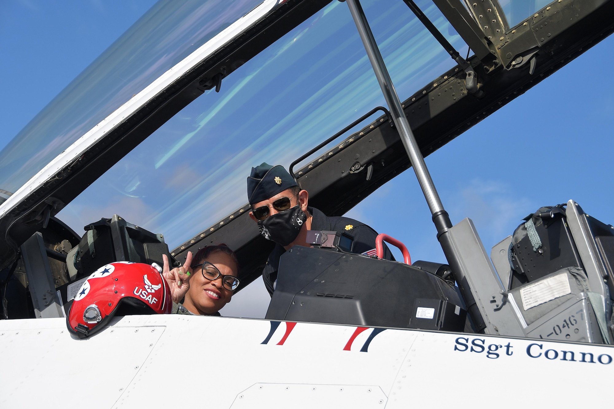 FeFe Handy, founder and president of Page Turners Make Great Learners, poses for a photo with Maj. Jason Markzon, Thunderbirds advance pilot and narrator, shortly before taking off at Dobbins Air Reserve Base, Ga., Oct. 23, 2020. Handy flew with the Thunderbirds as a Hometown Hero, a program where exceptional community members are recognized and given the opportunity to fly with the Thunderbirds. (U.S. Air Force photo/Airman 1st Class Kendra Ransum)