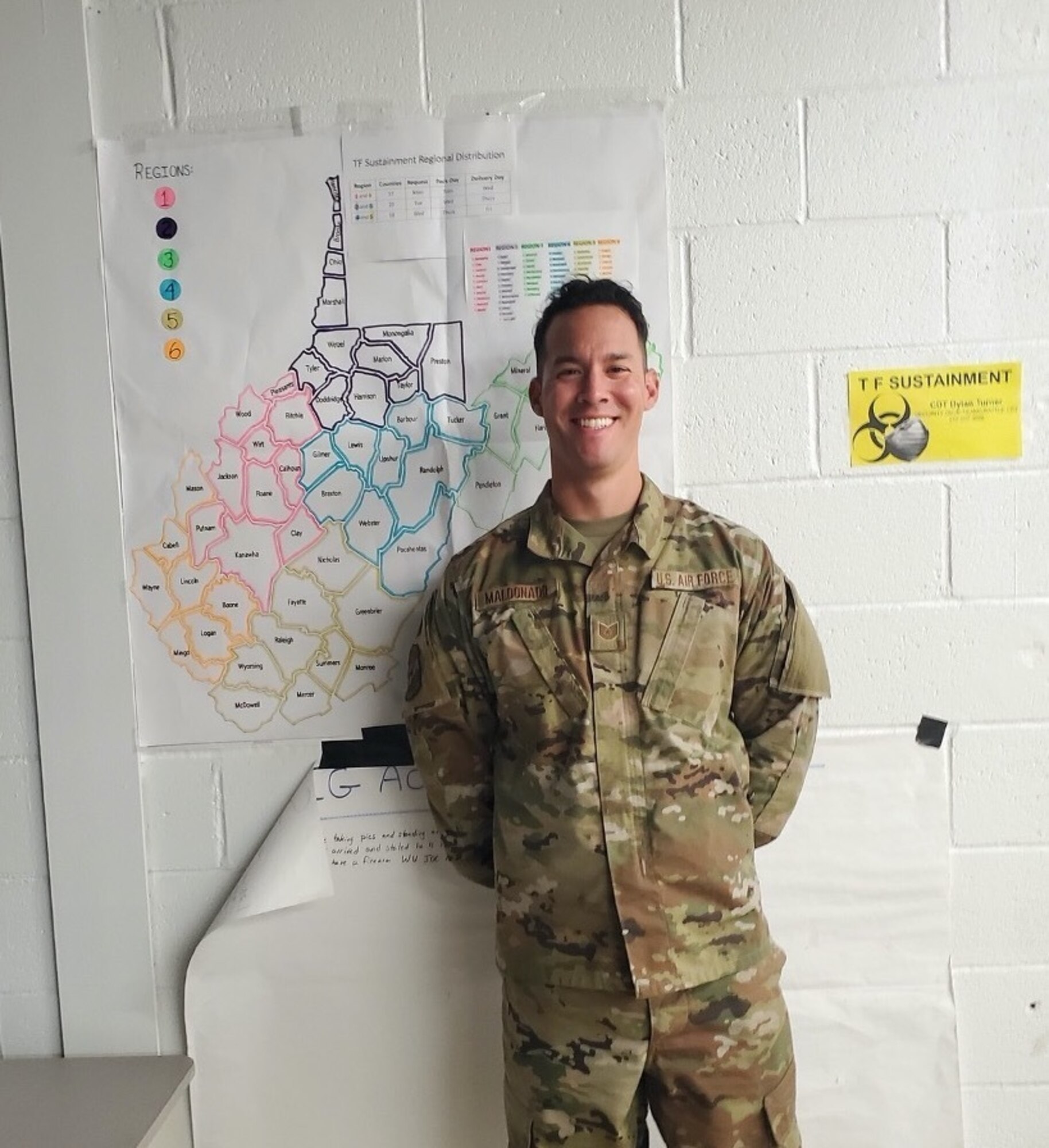 U.S. Tech. Sgt. Ivan Maldonado, a member of the 130th Airlift Wing’s Aerial Port Squadron, and currently assigned as the Personal Protective Equipment (PPE) Non-Commissioned Officer in Charge (NCOIC) for Task Force Sustainment (TF-Sustainment) during the West Virginia National Guard's COVID-19 pandemic response, poses for a photo in Eleanor, West Virginia, October, 2020. Maldonado is responsible to ensure that PPE order requests from county-level emergency managers, health departments, and additional medical and non-medical facilities and organizations are received, processed, and supplies shipped in a timely fashion. (Courtesy photo)