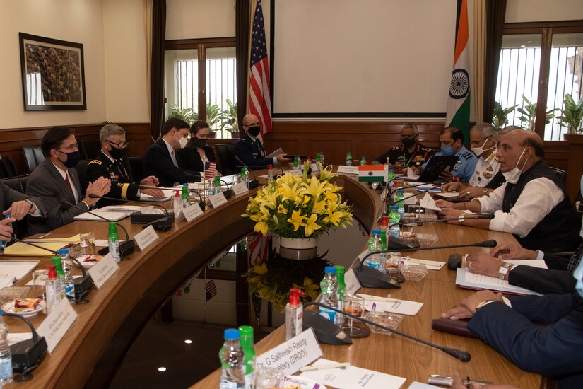 Defense Secretary Dr. Mark T. Esper meets with Indian officials around a large table.