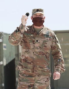 Lt. Col. Gregory Settle, of Effingham, Illinois, Commander, 2nd Battalion, 130th Infantry Regiment, talks to the Illinois Army National Guard Soldiers participating in the patching ceremony about the importance of the accomplishment each Soldier has achieved by receiving their combat patch.