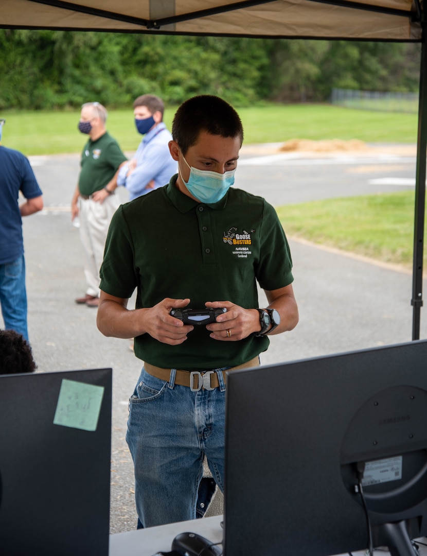 Isaac Downey, a team member of Goose Busters, controls the team’s robot using a PlayStation 4 controller.